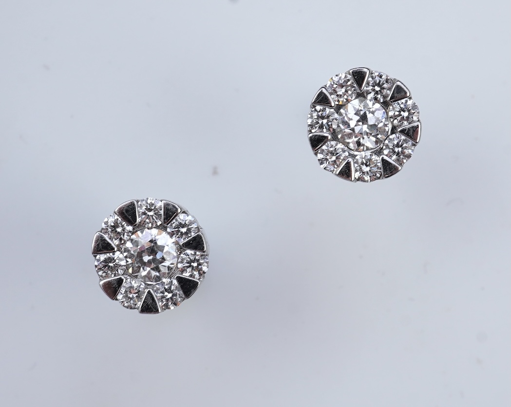 A pair of diamond stud earrings